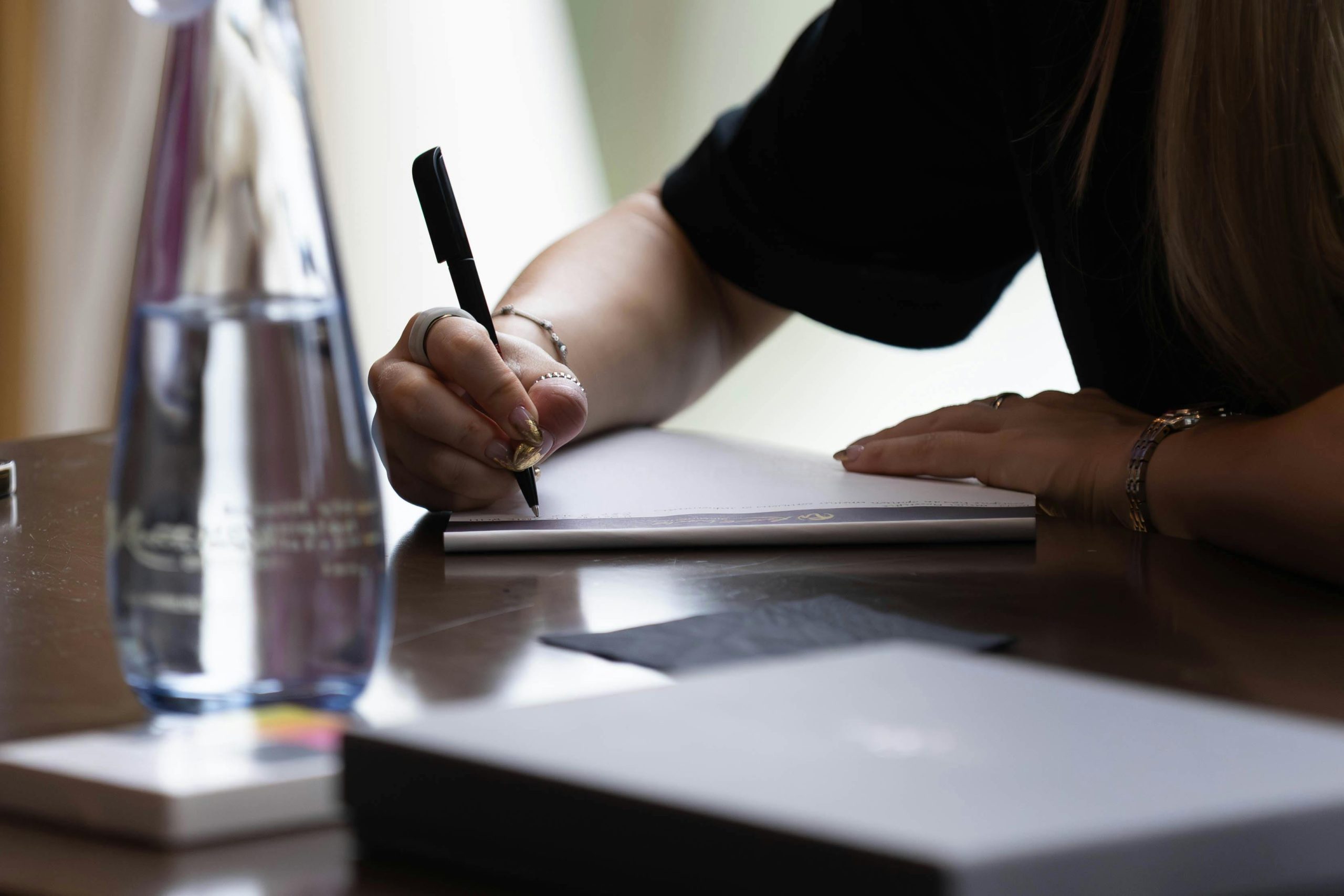 person writing on paper